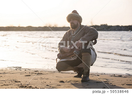 Man reenactor playing gusli Man reenactor playing gusli 50538646