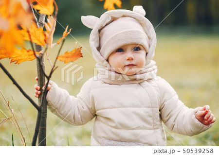 Little girl in a autumn park 50539258
