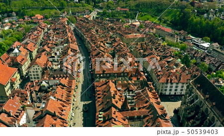 Flight over tiled roofs of the Old City of Bern, Switzerland 50539403