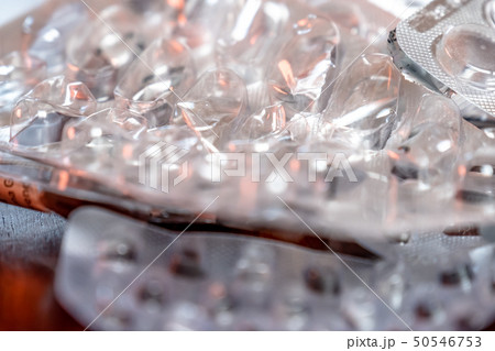 Empty blister packaging of medicine pills on wooden table 50546753