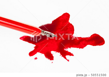 sharp nib in red dip pen over red ink stain sharp nib in red dip pen over red ink stain 50551500