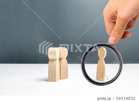 Magnifying glass is looking at the false human 50554032