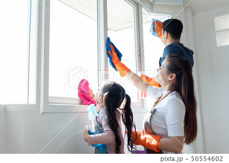 Asian Family helping cleaning House together. Asian Family helping cleaning House together. 50554602