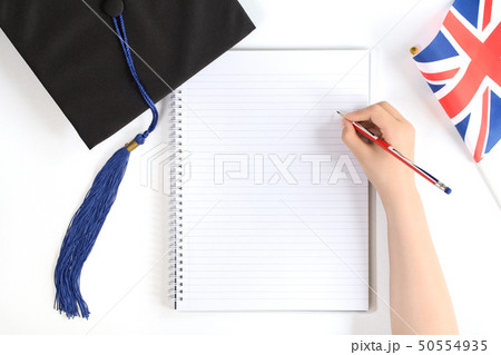 Black graduation cap with notebook isolated 50554935