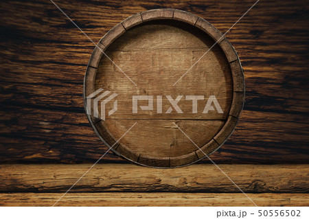 Wooden barrel and worn old table of wood. Wooden barrel and worn old table of wood. 50556502