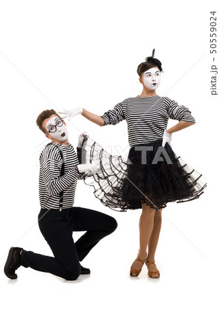 Smiling mimes in striped shirts. 50559024