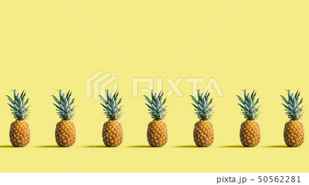 Pineapples on a solid color background Pineapples on a solid color background 50562281
