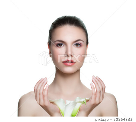 Beautiful woman with clear skin and flowers Beautiful woman with clear skin and flowers 50564332