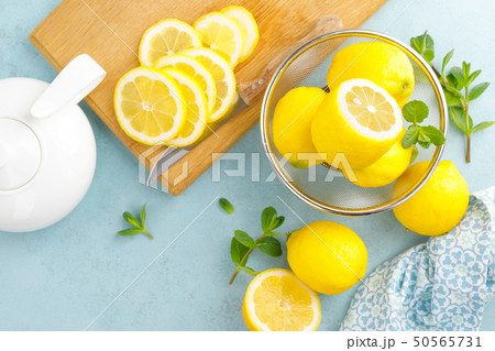 Sliced and whole lemons with mint Sliced and whole lemons with mint 50565731