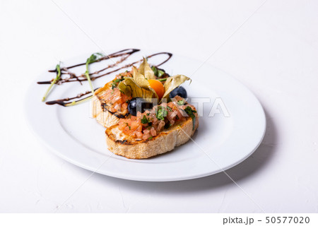 Delicious Italian antipasti bruschetta on white background. Close-up. 50577020