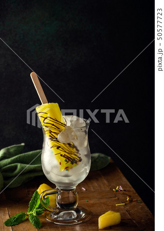 Delicious homemade pineapple popsicles 50577723