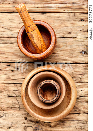 Empty wooden mortar 50578775