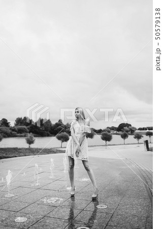 portrait of a young woman in a dress 50579138