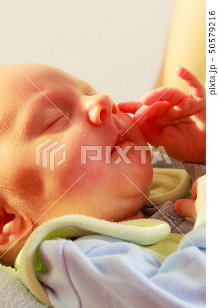 Little newborn baby sleeping calmly in blanket 50579216