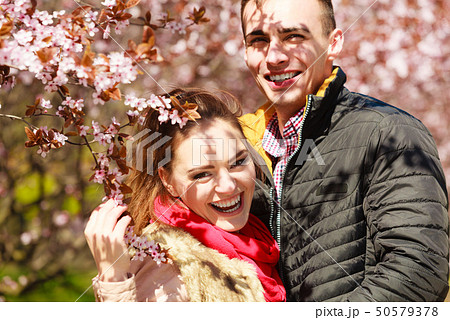 Couple in love walking in park at sunny spring day 50579378