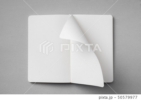 white notebook with turn page on grey background 50579977