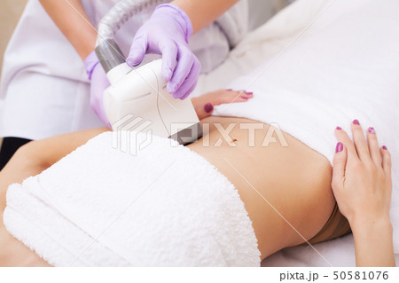 Body Care. Woman is in the process at the clinic lipomassage 50581076