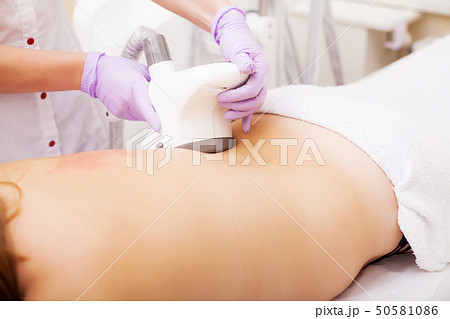 Body Care. Woman is in the process at the clinic lipomassage Body Care. Woman is in the process at the clinic lipomassage 50581086