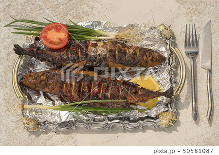 smoked scomber on a tray with foil 50581087