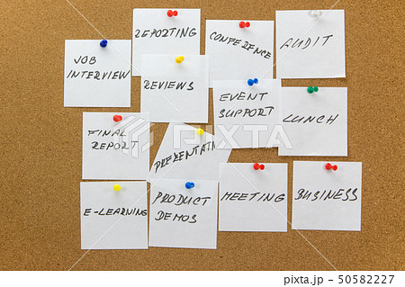 To-do tasks affixed to the corkboard. To-do tasks affixed to the corkboard. 50582227