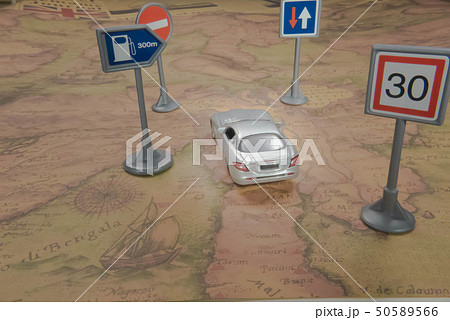 Travel concept. Toy cars on vintage World map 50589566
