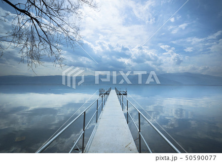 Metal pier on the lake 50590077