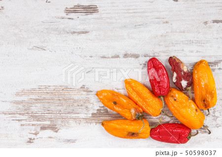 Old, moldy and wrinkled peppers Old, moldy and wrinkled peppers 50598037
