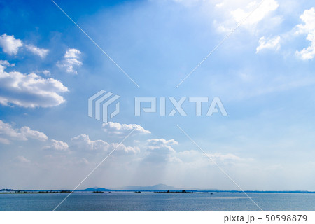Blue sky background with clouds in lake. 50598879