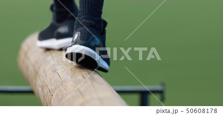 The feet of a athlete as she's walking on a wooden The feet of a athlete as she's walking on a wooden 50608178