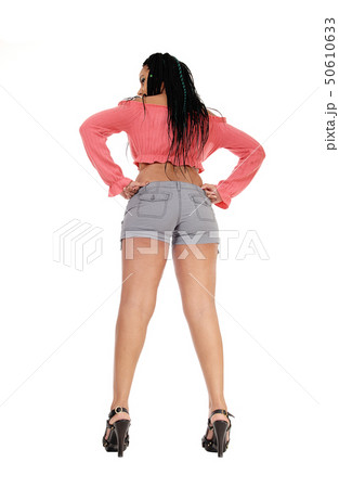 Woman standing from back with long legs 50610633