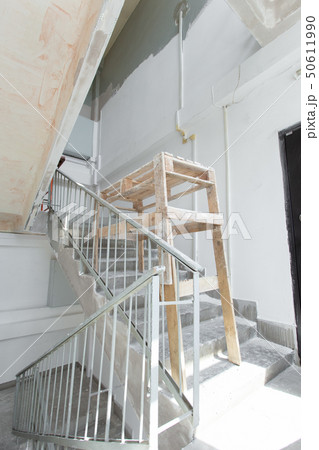 Room with ladders during under renovation, remodeling and construction Room with ladders during under renovation, remodeling and construction 50611990