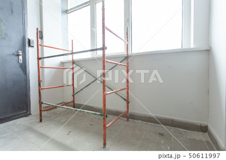 Room with ladders during under renovation, remodeling and construction Room with ladders during under renovation, remodeling and construction 50611997