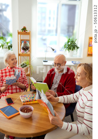 Good looking aged people participating in the reading club Good looking aged people participating in the reading club 50613312