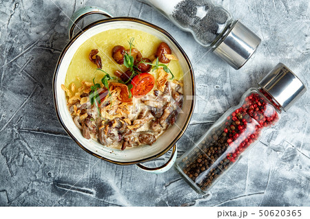 Beef stroganoff with mashed potatoes in a pot. top view, stone background 50620365