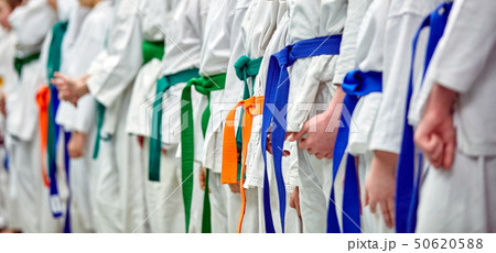 Concept karate, martial arts. Construction of students in the hall before training. Kimono Concept karate, martial arts. Construction of students in the hall before training. Kimono 50620588