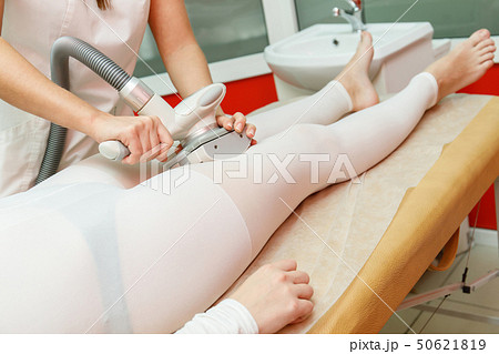 Beautician applying lpg procedure. Anti cellulite 50621819