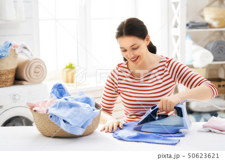 woman is ironing at home woman is ironing at home 50623621