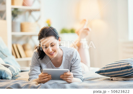 woman is working on tablet woman is working on tablet 50623622
