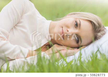 Girl resting on soft pillow 50628773