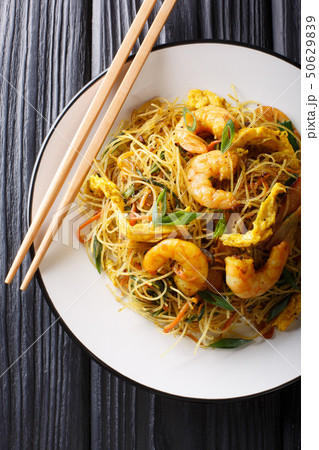 Fried Chinese rice noodles with sausage, shrimps 50629839