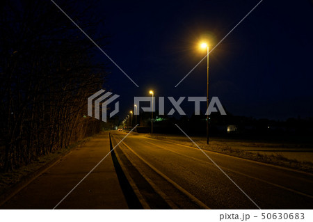 Road lights in night, street post shadow Road lights in night, street post shadow 50630683