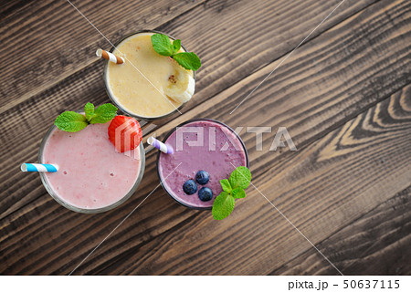 Three glass of fruit milkshakes 50637115
