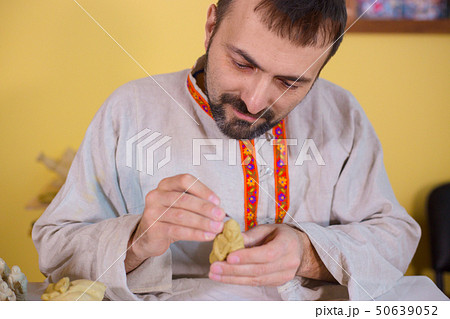 Potter making clay figure for board game Potter making clay figure for board game 50639052