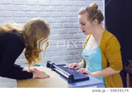 Professional women decorator working with kraft paper Professional women decorator working with kraft paper 50639174