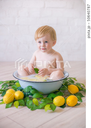 Baby Boy In An Antique Milk Bath With Fresh Fruit - Stock Photo [50640787]  - Pixta