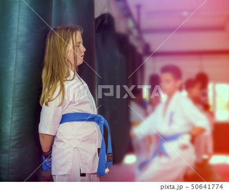 Young girl after karate training having a rest. 50641774
