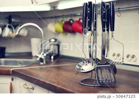 Kitchen utensils on  work top 50647125