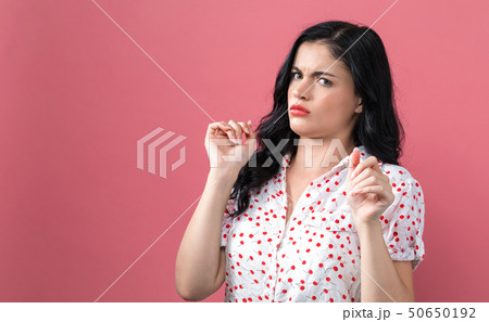 Disgusted face expression with young woman Disgusted face expression with young woman 50650192
