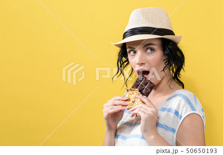 Young woman holding chocolate 50650193