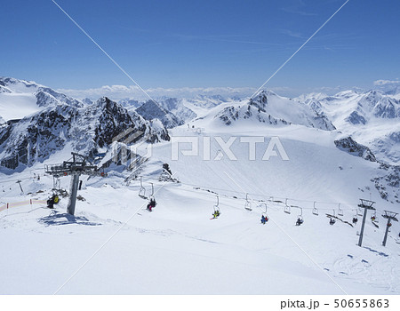 Scenic view from top of Wildspitz on winter landscape with snow covered mountain slopes and pistes Scenic view from top of Wildspitz on winter landscape with snow covered mountain slopes and pistes 50655863